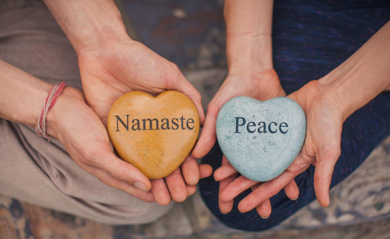 Hands with namaste rocks